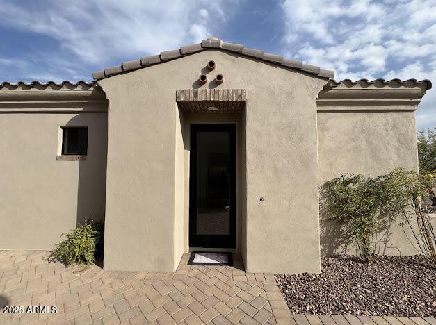 property entrance with a patio area