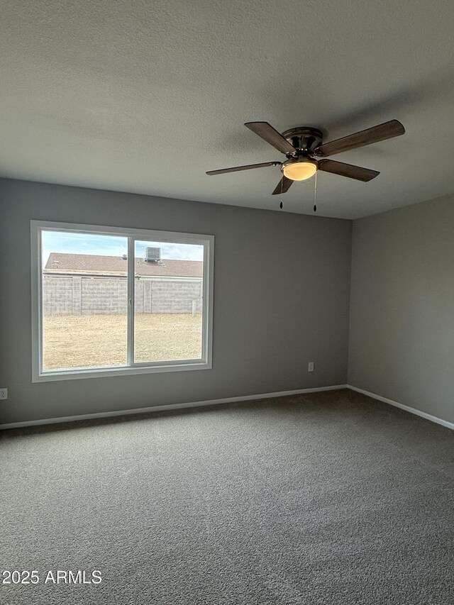 3749 W Gelding Dr, Phoenix, AZ 85053 - carpeted empty room featuring baseboards, a ceiling fan, and a textured ceiling