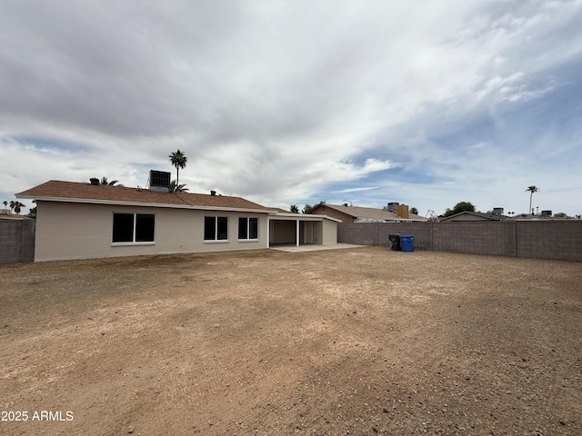 3749 W Gelding Dr, Phoenix, AZ 85053 - rear view of property with central air condition unit, a patio, and a fenced backyard