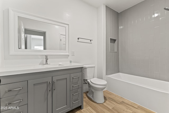 5808 W Myrtle Ave, Glendale, AZ 85301 - full bath featuring vanity, toilet, wood finished floors, and bathtub / shower combination
