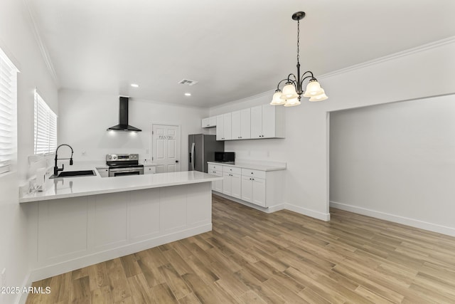 5808 W Myrtle Ave, Glendale, AZ 85301 - kitchen with wall chimney exhaust hood, appliances with stainless steel finishes, crown molding, a chandelier, and light countertops