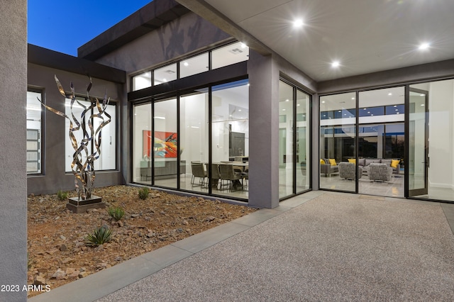 property entrance with a patio