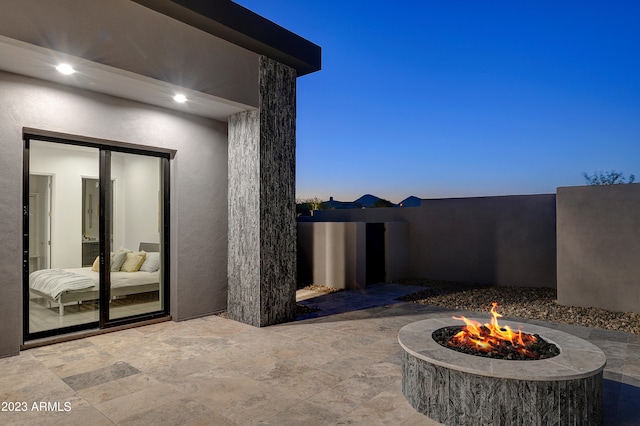 patio terrace at dusk with a fire pit