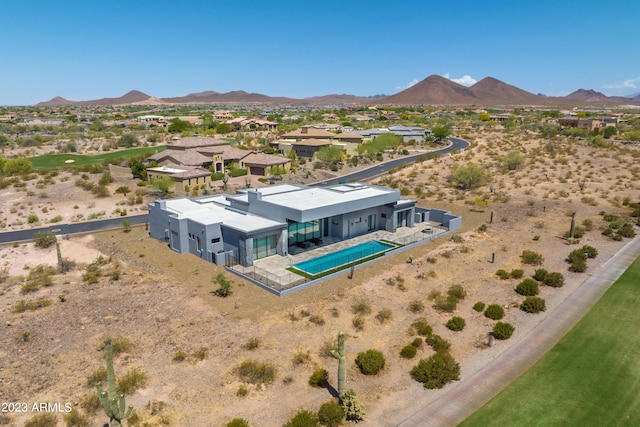 birds eye view of property with a mountain view