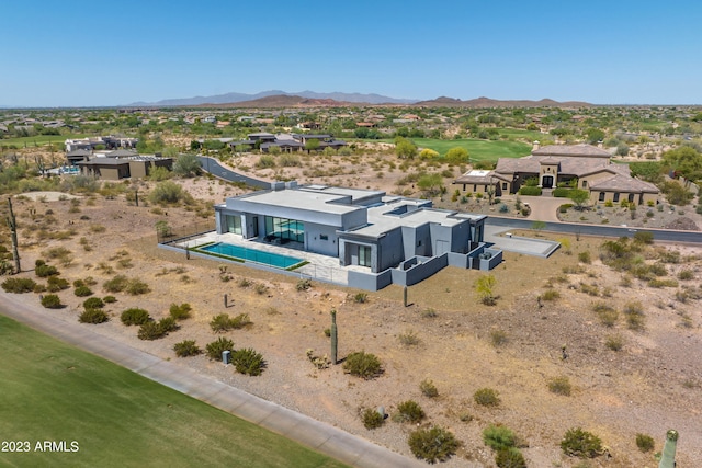 birds eye view of property with a mountain view