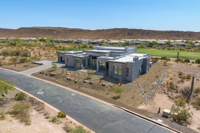 birds eye view of property with a mountain view