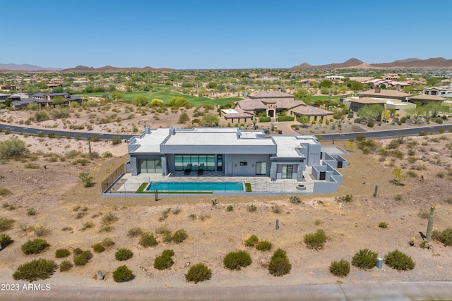 birds eye view of property featuring a mountain view