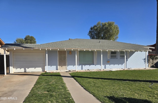 single story home featuring driveway, a front lawn, roof with shingles, and an attached garage