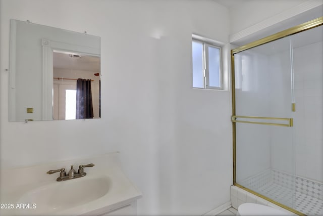 full bath featuring toilet, a shower stall, and vanity