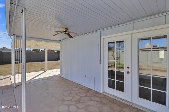 view of patio / terrace with french doors, fence, and ceiling fan