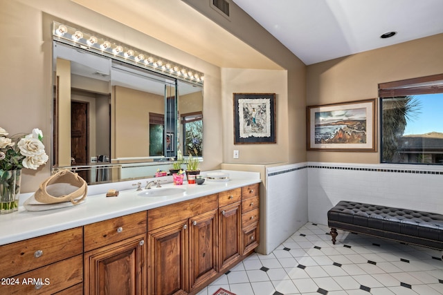 bathroom featuring tile patterned flooring and vanity