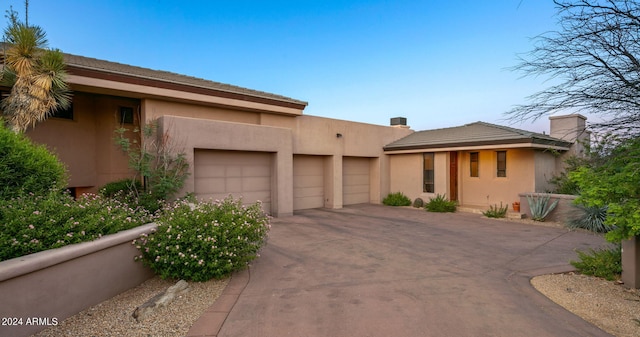 view of front of property featuring a garage