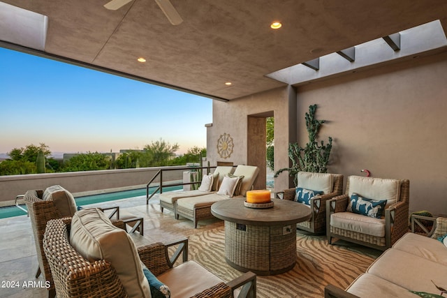 patio terrace at dusk with outdoor lounge area