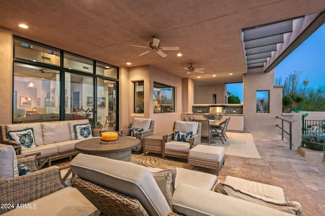 view of patio featuring an outdoor hangout area and ceiling fan