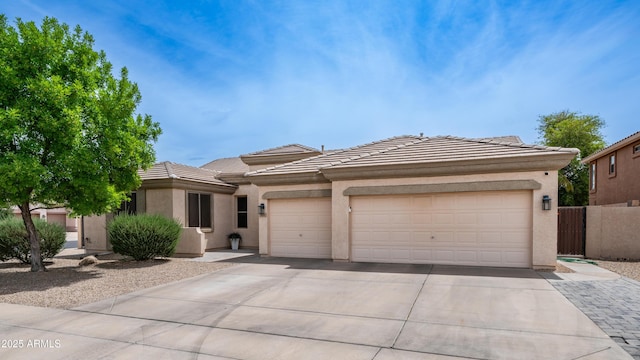 3103 S Benton, Mesa, AZ 85212 - prairie-style home with concrete driveway, a garage, a tile roof, and stucco siding