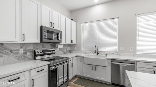 3103 S Benton, Mesa, AZ 85212 - kitchen with stainless steel appliances, a sink, white cabinetry, backsplash, and recessed lighting