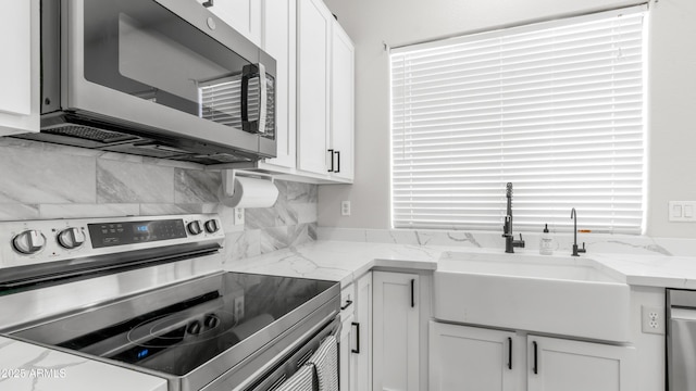 3103 S Benton, Mesa, AZ 85212 - kitchen featuring appliances with stainless steel finishes, a sink, and white cabinetry