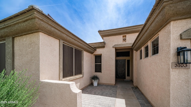 3103 S Benton, Mesa, AZ 85212 - doorway to property with stucco siding and a patio