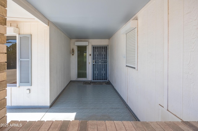 property entrance featuring a wall mounted air conditioner