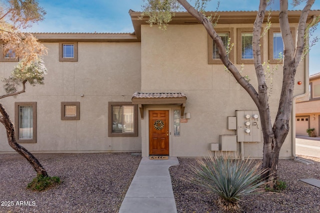 view of front of house featuring stucco siding