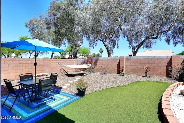 3122 E Kristal Way, Phoenix, AZ 85050 - fenced backyard featuring a patio area and outdoor dining area