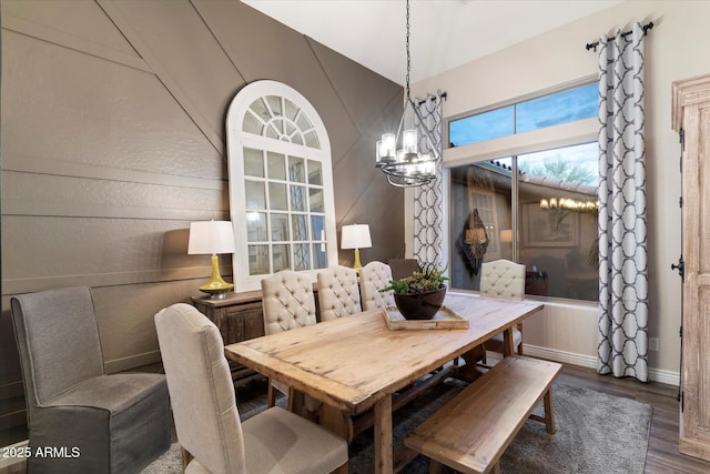 dining room featuring an inviting chandelier and dark hardwood / wood-style floors