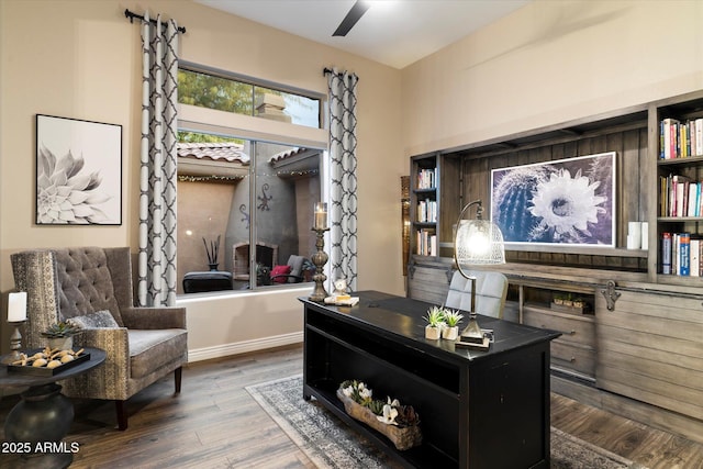 sitting room with hardwood / wood-style flooring