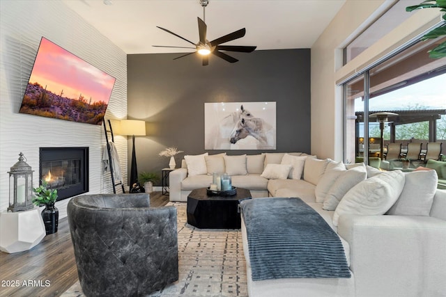 living room with hardwood / wood-style flooring and ceiling fan