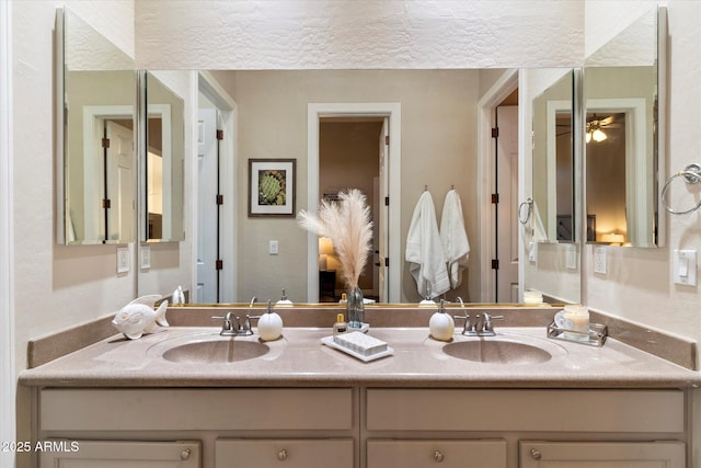 bathroom with vanity and ceiling fan