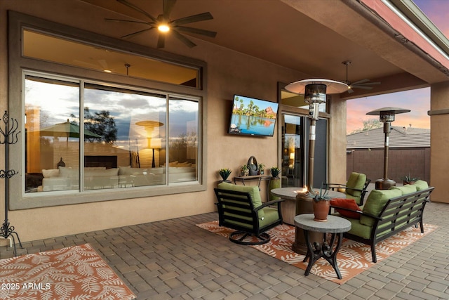 patio terrace at dusk with ceiling fan