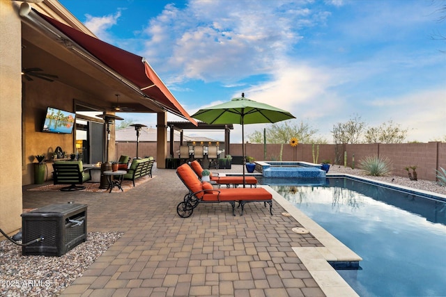 view of swimming pool featuring an in ground hot tub, exterior bar, and a patio