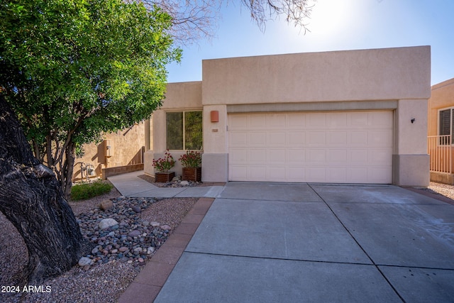 southwest-style home with a garage