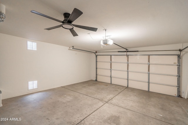 garage featuring ceiling fan and a garage door opener