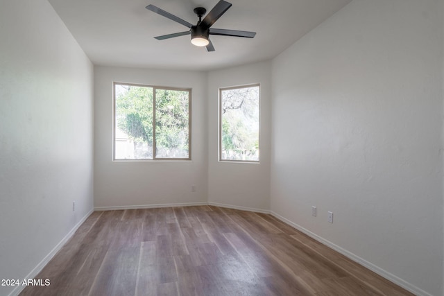 spare room featuring ceiling fan and light hardwood / wood-style floors