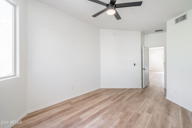 spare room featuring ceiling fan and light hardwood / wood-style floors