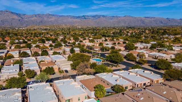 birds eye view of property featuring a mountain view