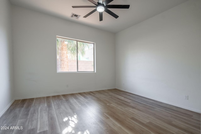 empty room with light hardwood / wood-style floors and ceiling fan