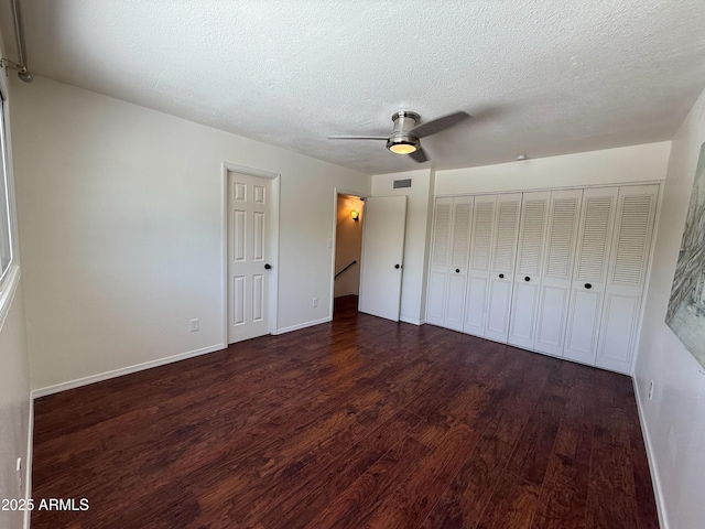 3145 W Acoma Dr, Phoenix, AZ 85053 - unfurnished bedroom with wood finished floors, a textured ceiling, and ceiling fan