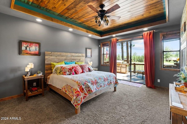 carpeted bedroom with a tray ceiling, wooden ceiling, access to outside, baseboards, and a ceiling fan