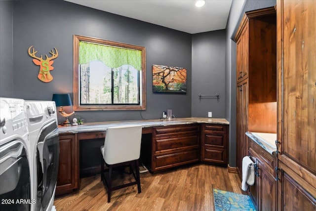 laundry area with cabinet space, independent washer and dryer, wood finished floors, a desk, and recessed lighting
