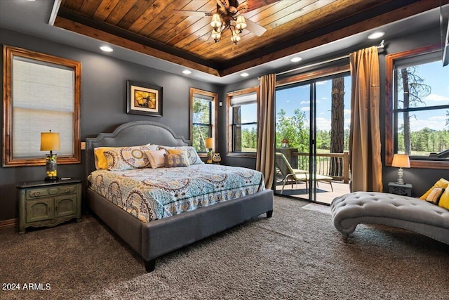 bedroom with wood ceiling, dark carpet, access to exterior, a tray ceiling, and recessed lighting