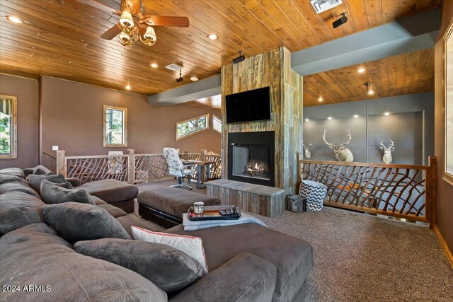 living area featuring wooden ceiling, carpet floors, a ceiling fan, a fireplace, and recessed lighting