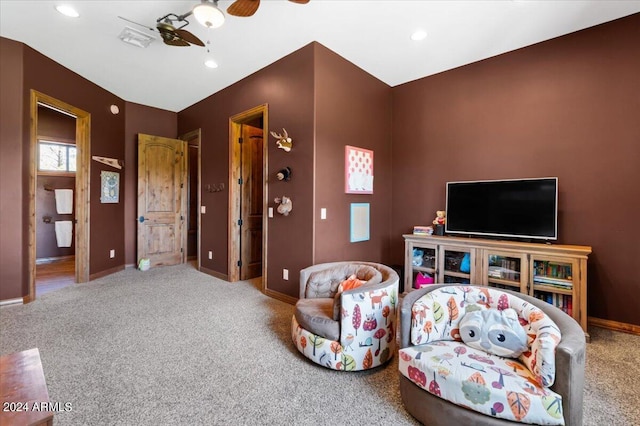 carpeted living area featuring baseboards, a ceiling fan, and recessed lighting
