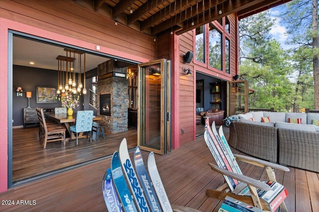 deck featuring an outdoor hangout area and outdoor dining space