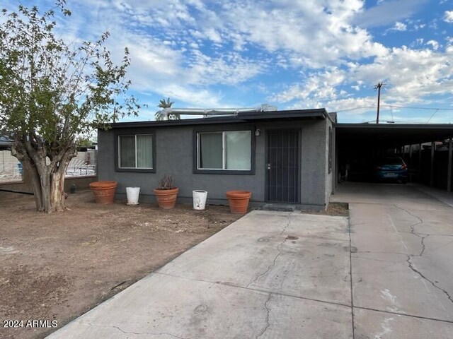 exterior space featuring a carport