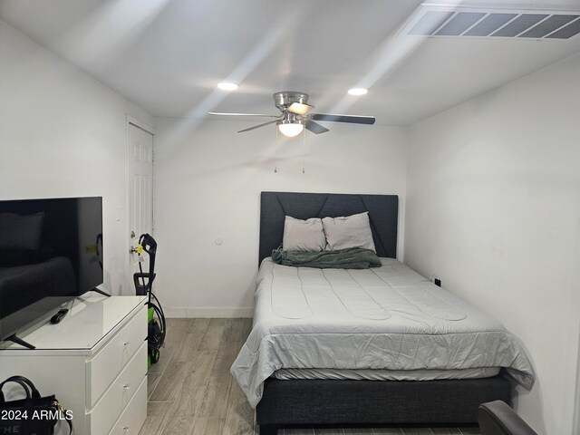 bedroom featuring light wood-type flooring and ceiling fan