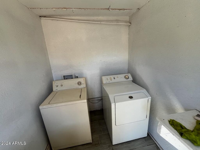 laundry area featuring washing machine and clothes dryer