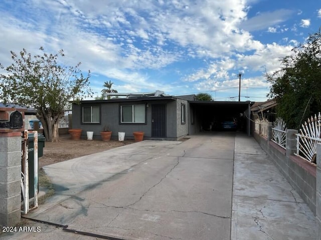 view of front of property with a carport