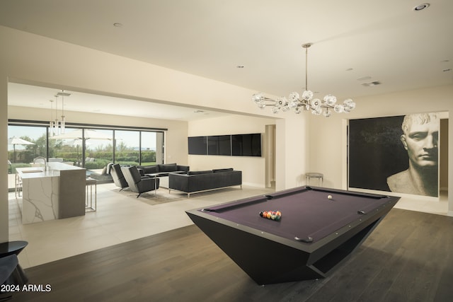 playroom featuring a chandelier, hardwood / wood-style flooring, and billiards