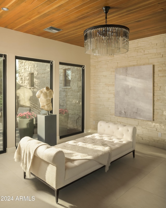 sitting room featuring light tile patterned flooring and wood ceiling